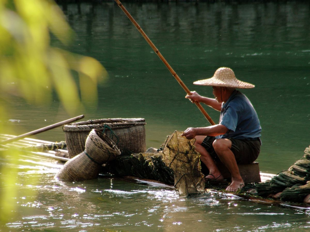 man fishing at xi river